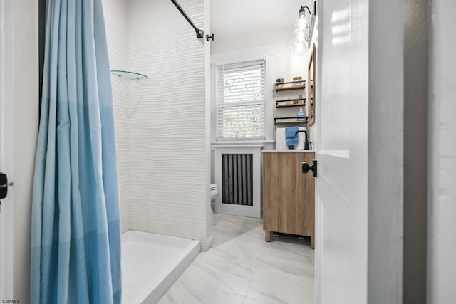 bathroom featuring curtained shower and toilet