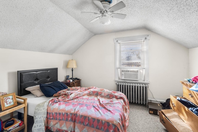 carpeted bedroom with a textured ceiling, radiator, ceiling fan, and lofted ceiling