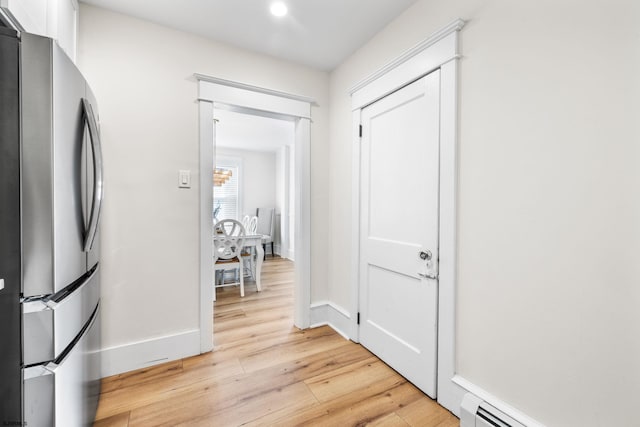 corridor featuring light hardwood / wood-style floors