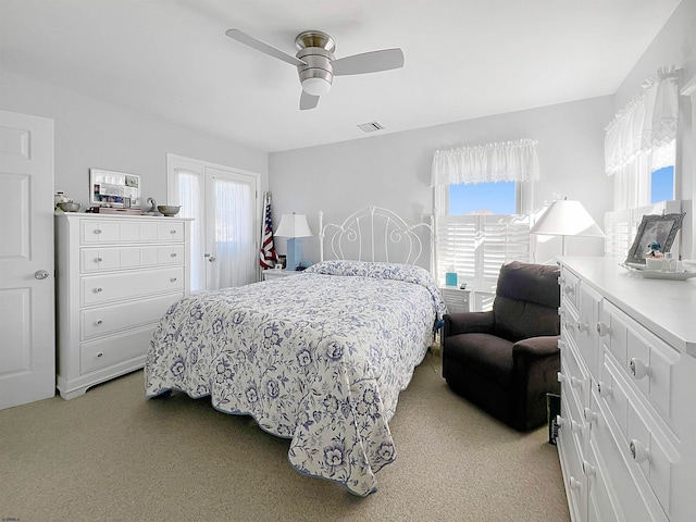 carpeted bedroom with ceiling fan