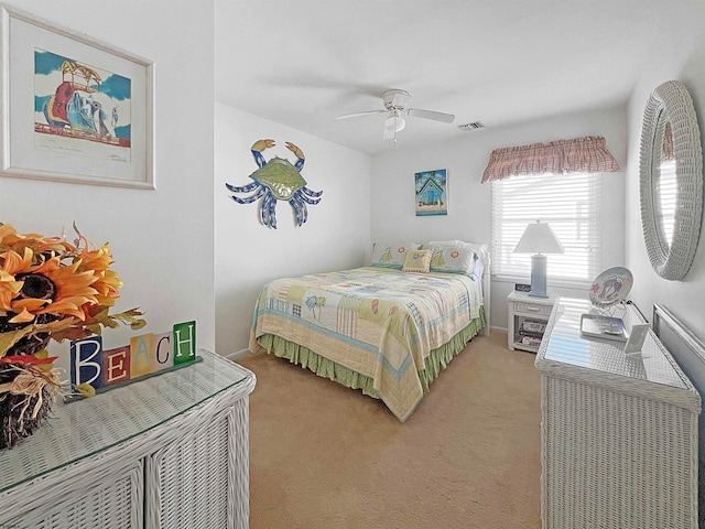 bedroom with ceiling fan and light colored carpet