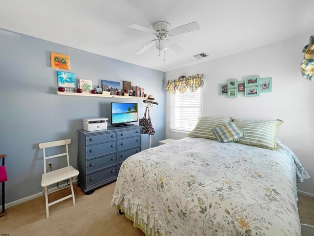 bedroom featuring ceiling fan and light colored carpet