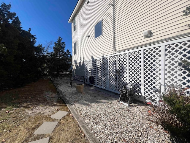 view of side of home featuring a patio