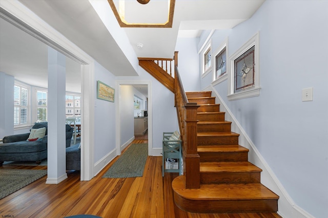 staircase featuring wood-type flooring