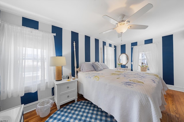 bedroom featuring ceiling fan and hardwood / wood-style flooring