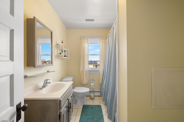 bathroom with tile patterned flooring, vanity, a baseboard radiator, and toilet