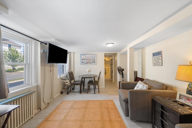 living room with light hardwood / wood-style flooring and radiator