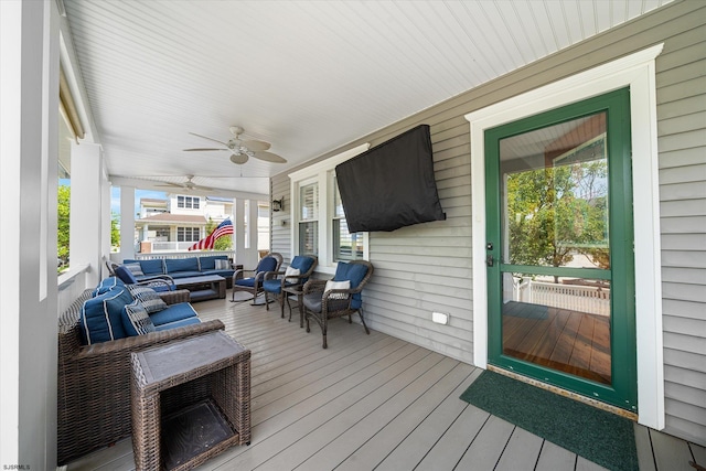 deck featuring ceiling fan and an outdoor hangout area