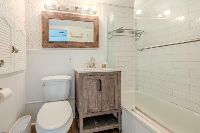 full bathroom featuring vanity, toilet, and tiled shower / bath combo