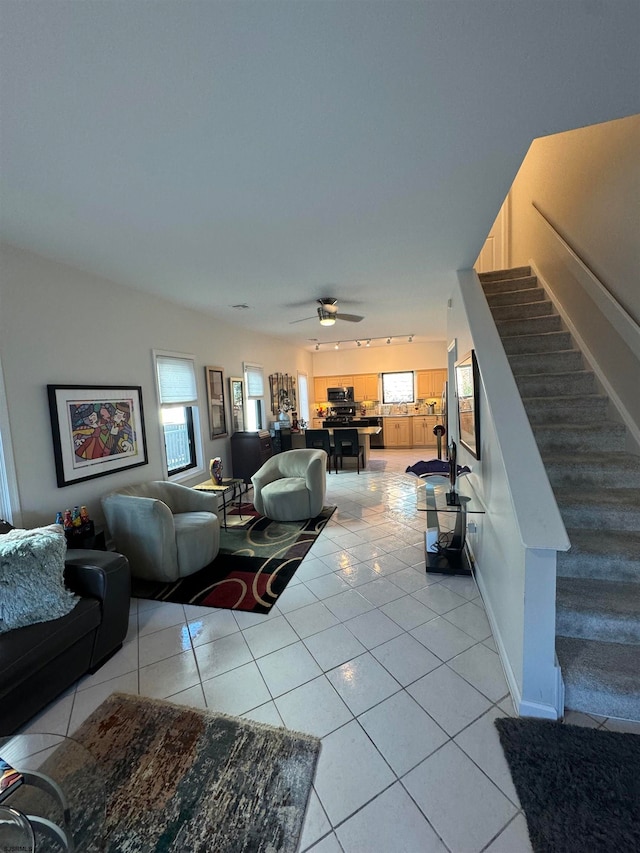 tiled living room featuring ceiling fan