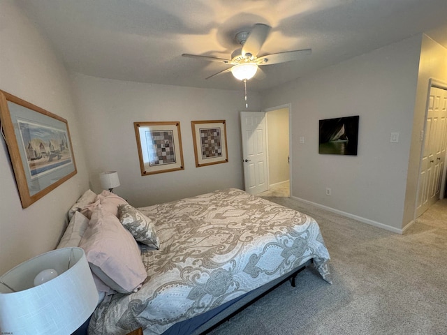 bedroom featuring ceiling fan and light carpet