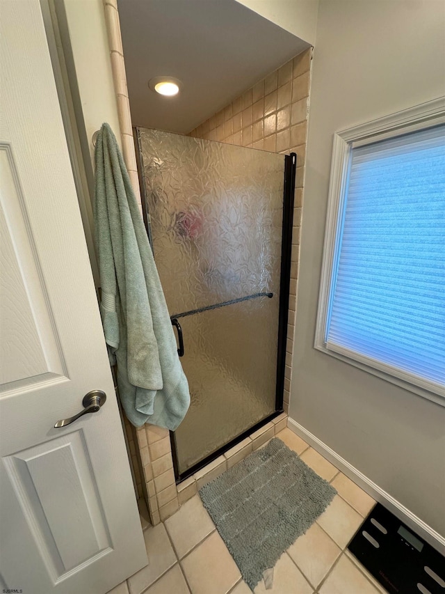 bathroom featuring tile patterned floors and walk in shower