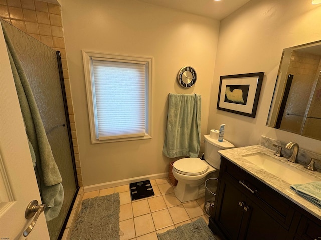 bathroom with toilet, vanity, tile patterned floors, and an enclosed shower