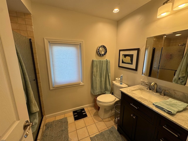 bathroom with tile patterned flooring, vanity, toilet, and an enclosed shower