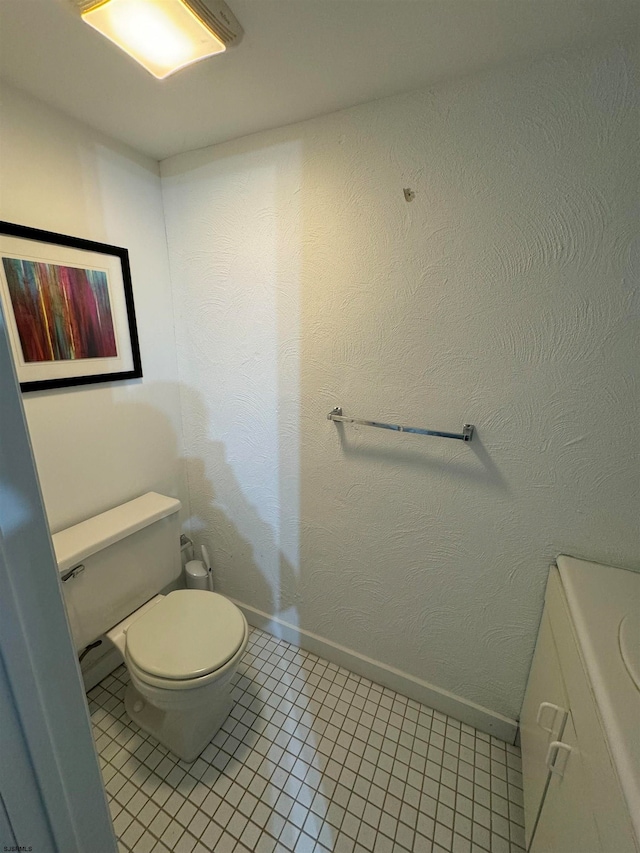 bathroom featuring toilet and tile patterned floors