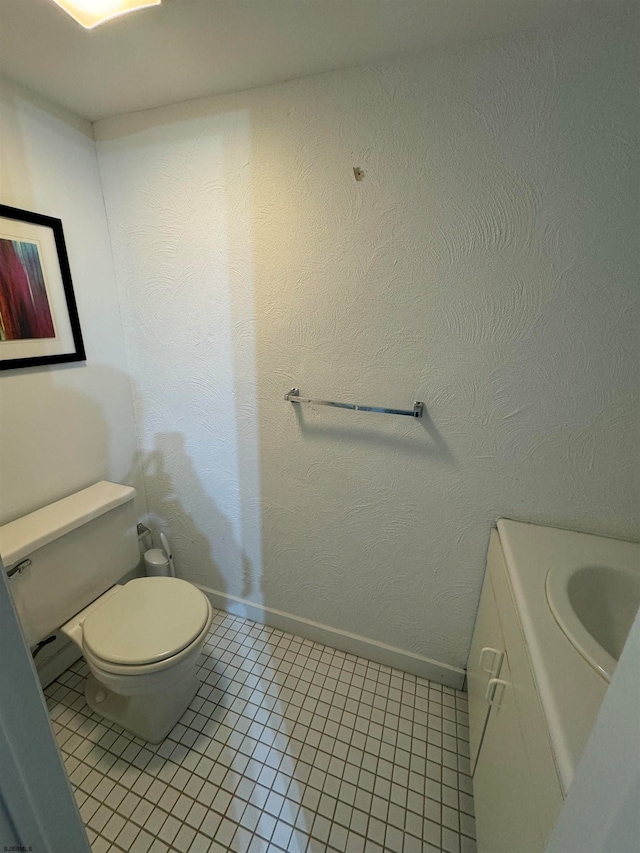 bathroom with tile patterned floors and toilet