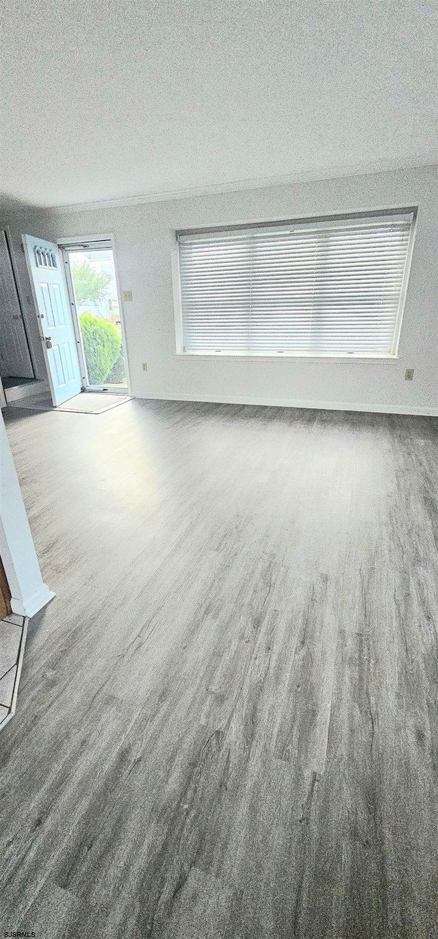 unfurnished living room with a textured ceiling