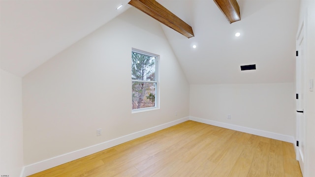 bonus room featuring vaulted ceiling with beams and light hardwood / wood-style floors