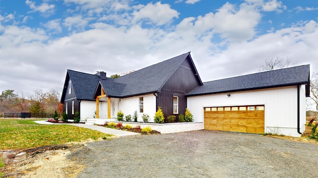 modern farmhouse style home featuring a garage