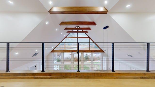 details with wood-type flooring and beamed ceiling