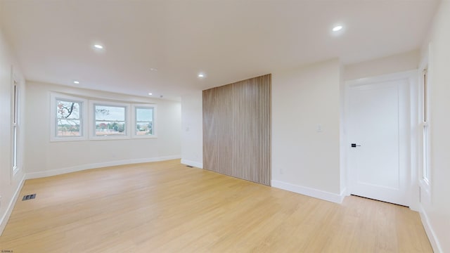 spare room featuring light wood-type flooring