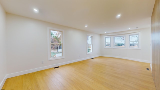 unfurnished room featuring light hardwood / wood-style flooring