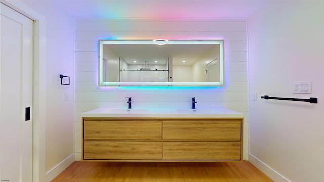 bathroom featuring hardwood / wood-style flooring and vanity