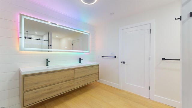 bathroom featuring vanity and hardwood / wood-style floors