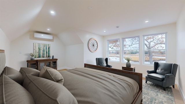 bedroom with multiple windows, vaulted ceiling, a wall mounted AC, and light hardwood / wood-style flooring