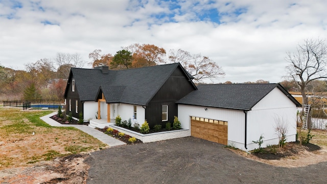 modern farmhouse style home with a garage