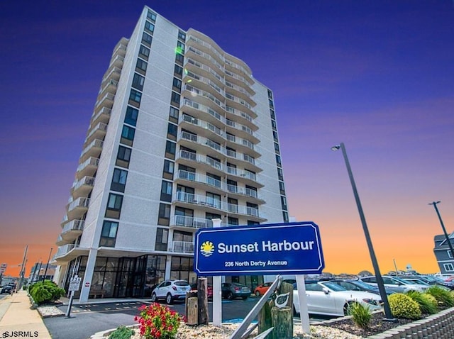 view of outdoor building at dusk