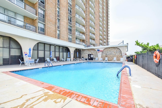 view of swimming pool with a patio