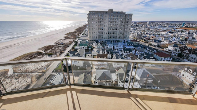 aerial view with a beach view and a water view