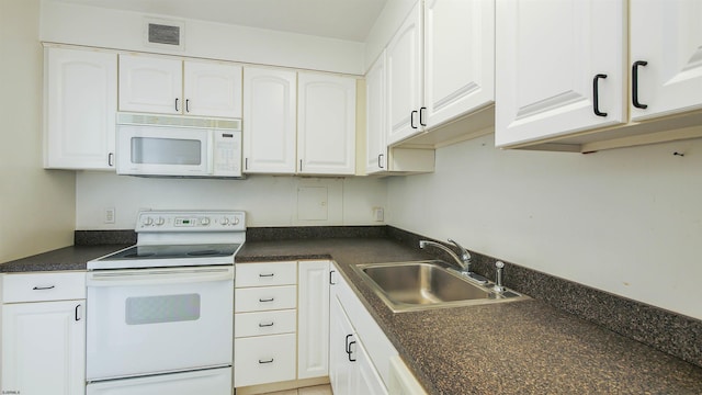 kitchen with white cabinets, white appliances, and sink