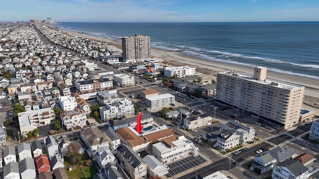 bird's eye view with a view of the beach and a water view