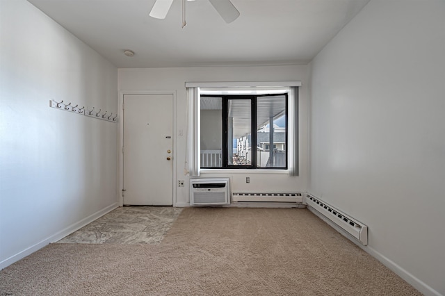 spare room featuring a wall unit AC, light carpet, ceiling fan, and a baseboard radiator