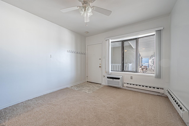 carpeted spare room featuring baseboard heating, a wall mounted AC, and ceiling fan