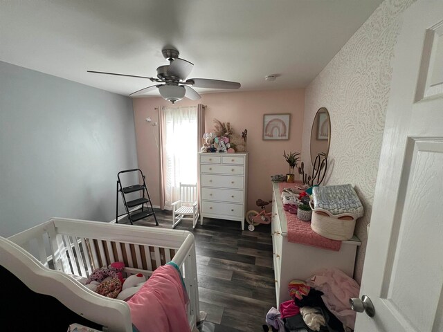 bedroom with dark wood-type flooring and ceiling fan