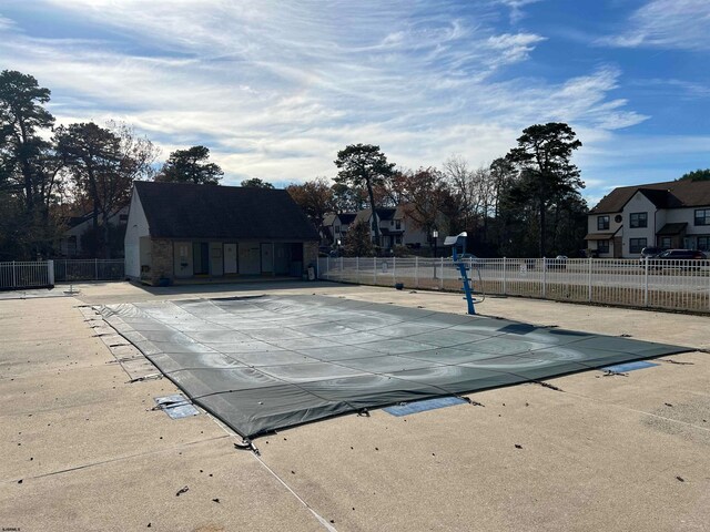 view of pool featuring a patio and central AC unit