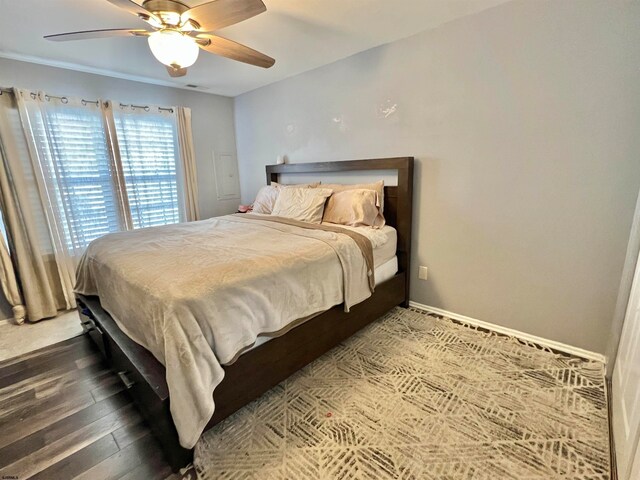 bedroom featuring wood-type flooring and ceiling fan