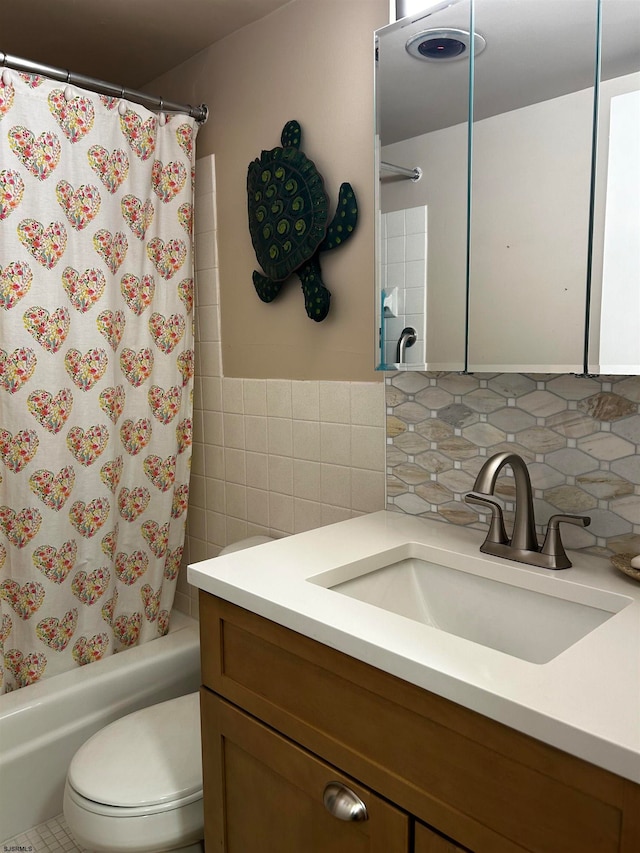 full bathroom with decorative backsplash, shower / bath combination with curtain, vanity, and toilet