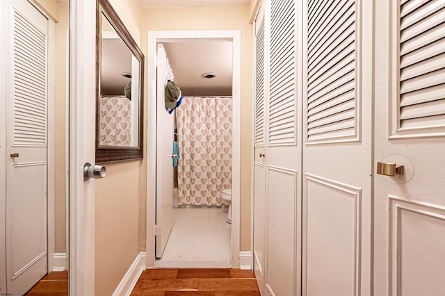 hallway featuring hardwood / wood-style flooring