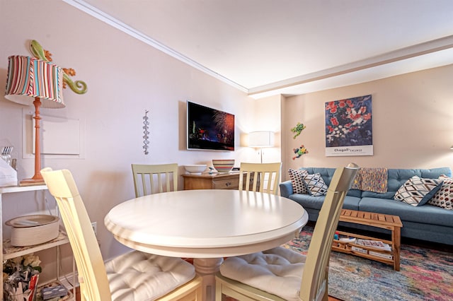 dining room featuring ornamental molding