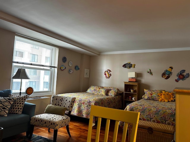 bedroom with hardwood / wood-style flooring and ornamental molding