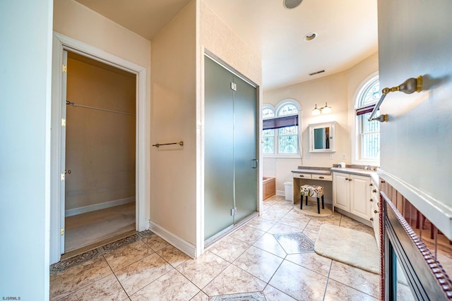 bathroom featuring vanity and shower with separate bathtub