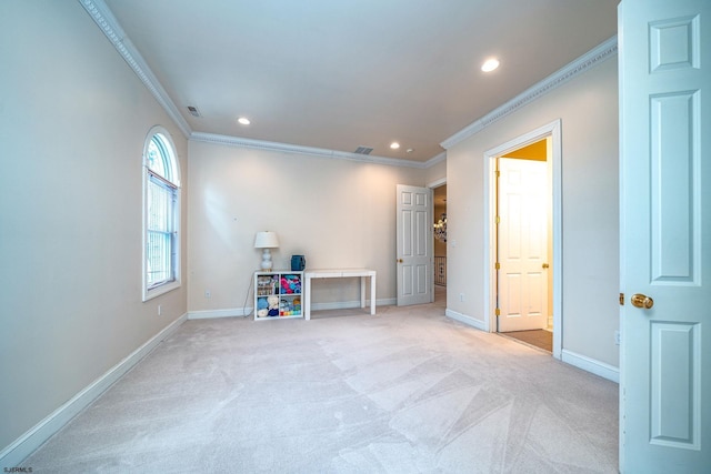 carpeted spare room featuring ornamental molding