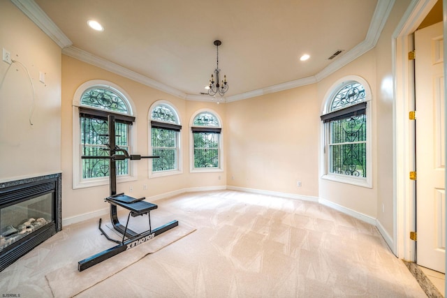 exercise room featuring crown molding, light carpet, and an inviting chandelier