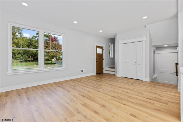 unfurnished living room with light hardwood / wood-style floors