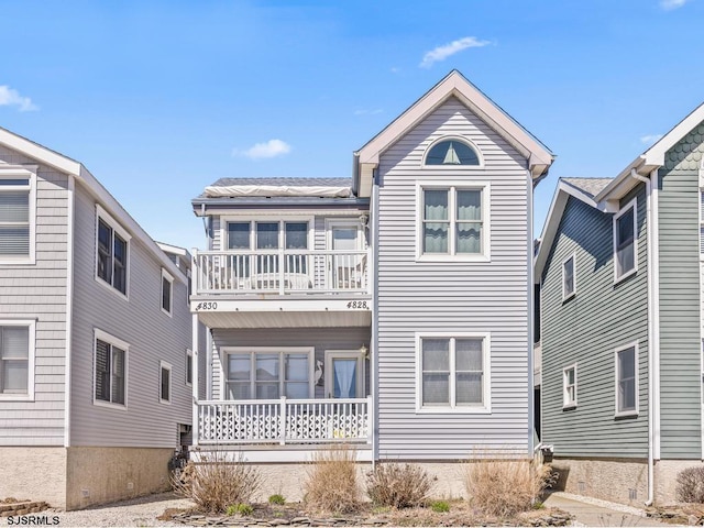 view of front of home with a balcony