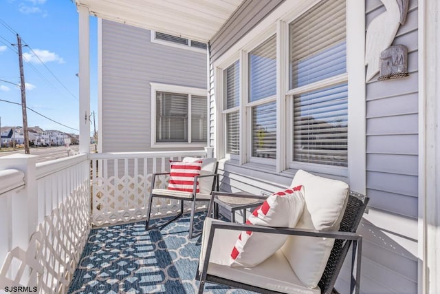 balcony featuring a porch